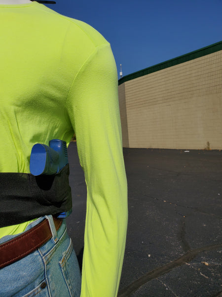 Demonstrating belly band cross draw holster.